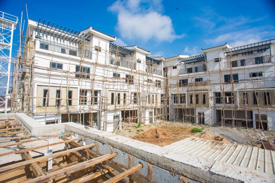 Close view of a Ivory terrace balcony and roof parapet, still surrounded by scaffolding