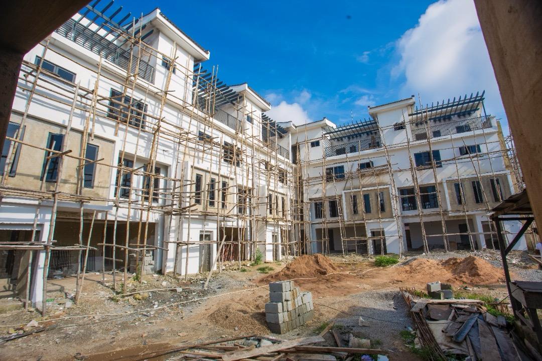 Wide view of The Ivory internal courtyard, with unfinished walls, scaffolding and building materials on the ground