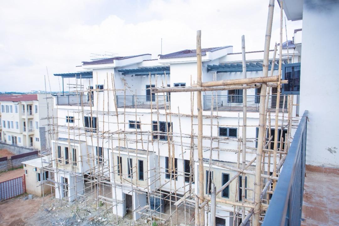 Elevated view over The Ivory rooftops, showing the pergola frames and scaffolding still in place